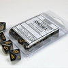 Set of ten opaque black and gold d10 dice from THE MIGHTY HOBBY SHOP, featuring numbered faces for tabletop gaming.
