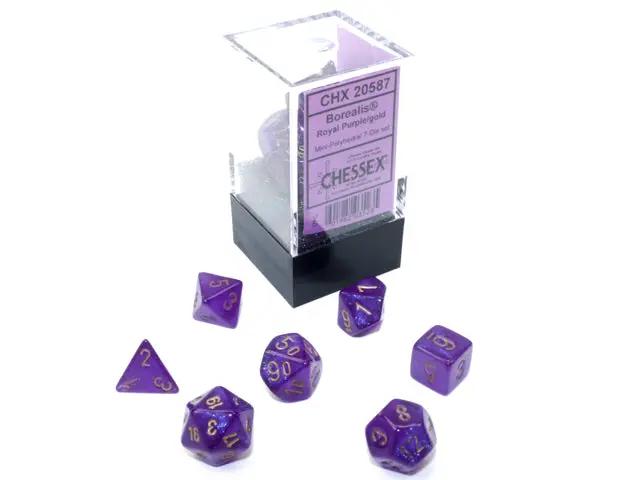 Seven-sided Chessex mini-hedral die from THE MIGHTY HOBBY SHOP, showing colorful numbered faces on a white background.