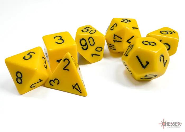 Opaque yellow polyhedral 7-dice set by Chessex, featuring various shapes like d20, d12, and d6 for tabletop gaming.