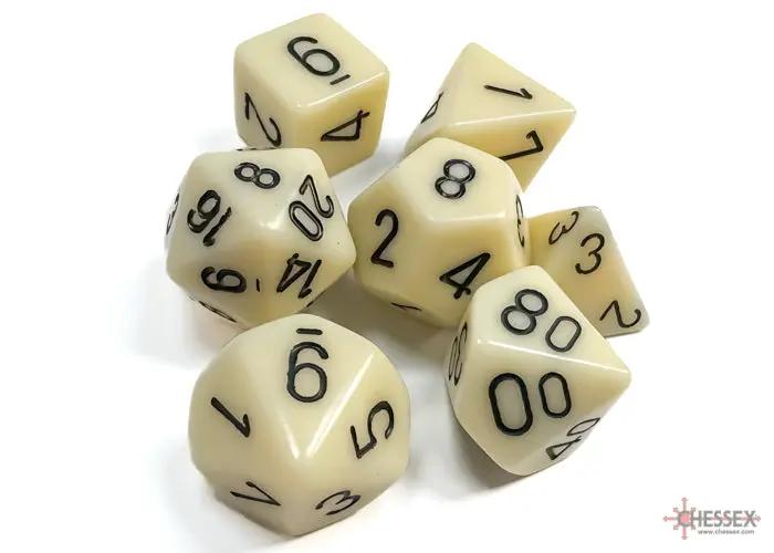 Set of seven opaque ivory polyhedral dice by THE MIGHTY HOBBY SHOP, including d20, d12, d10, d8, d6, d4, and percentile dice.