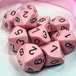 Set of ten pink d10 dice from Chessex, featuring bold numbers and a smooth surface, ideal for tabletop role-playing games.