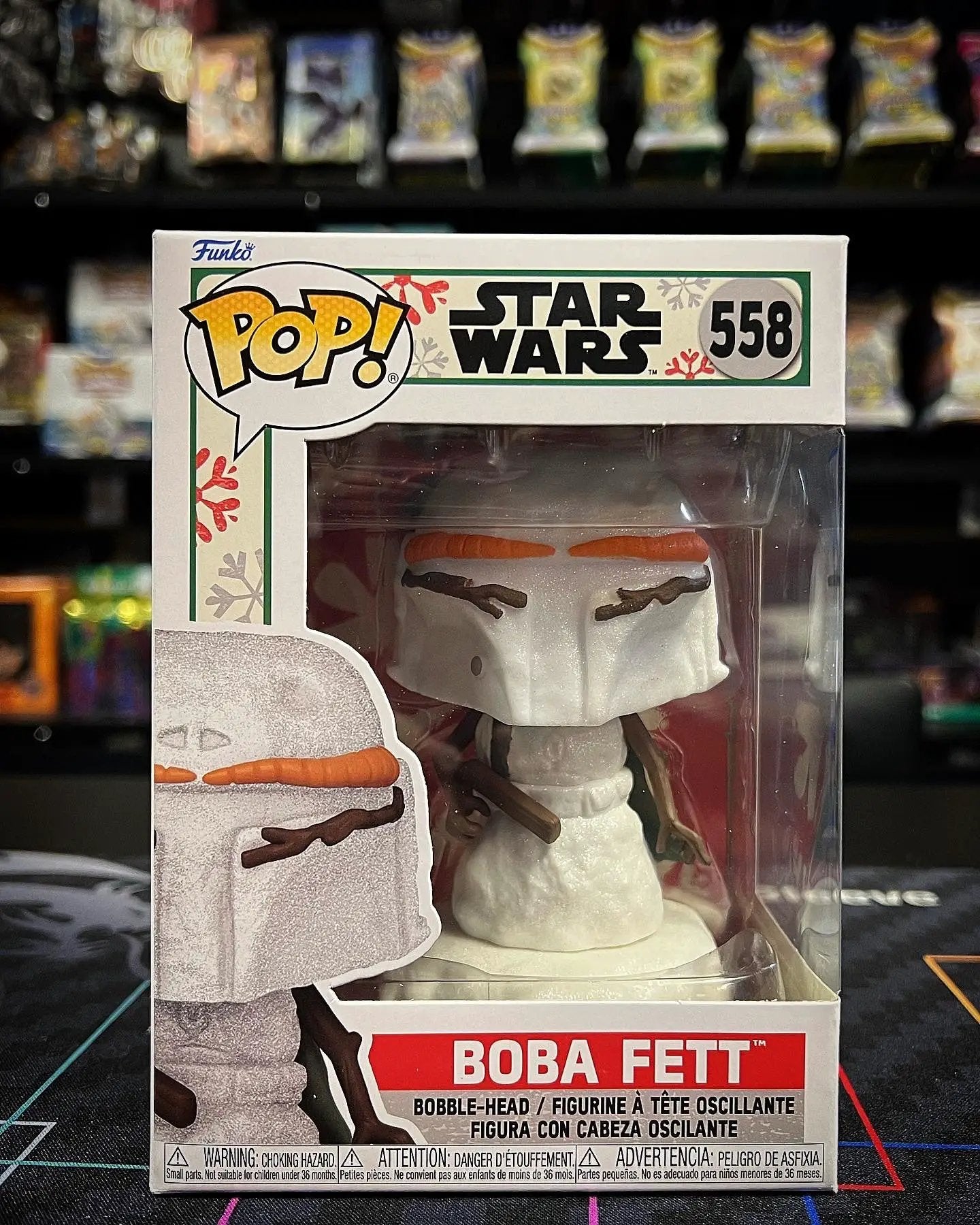 Pop! Star Wars Holiday Boba Fett vinyl figure from THE MIGHTY HOBBY SHOP, featuring Boba Fett in holiday-themed costume with festive details