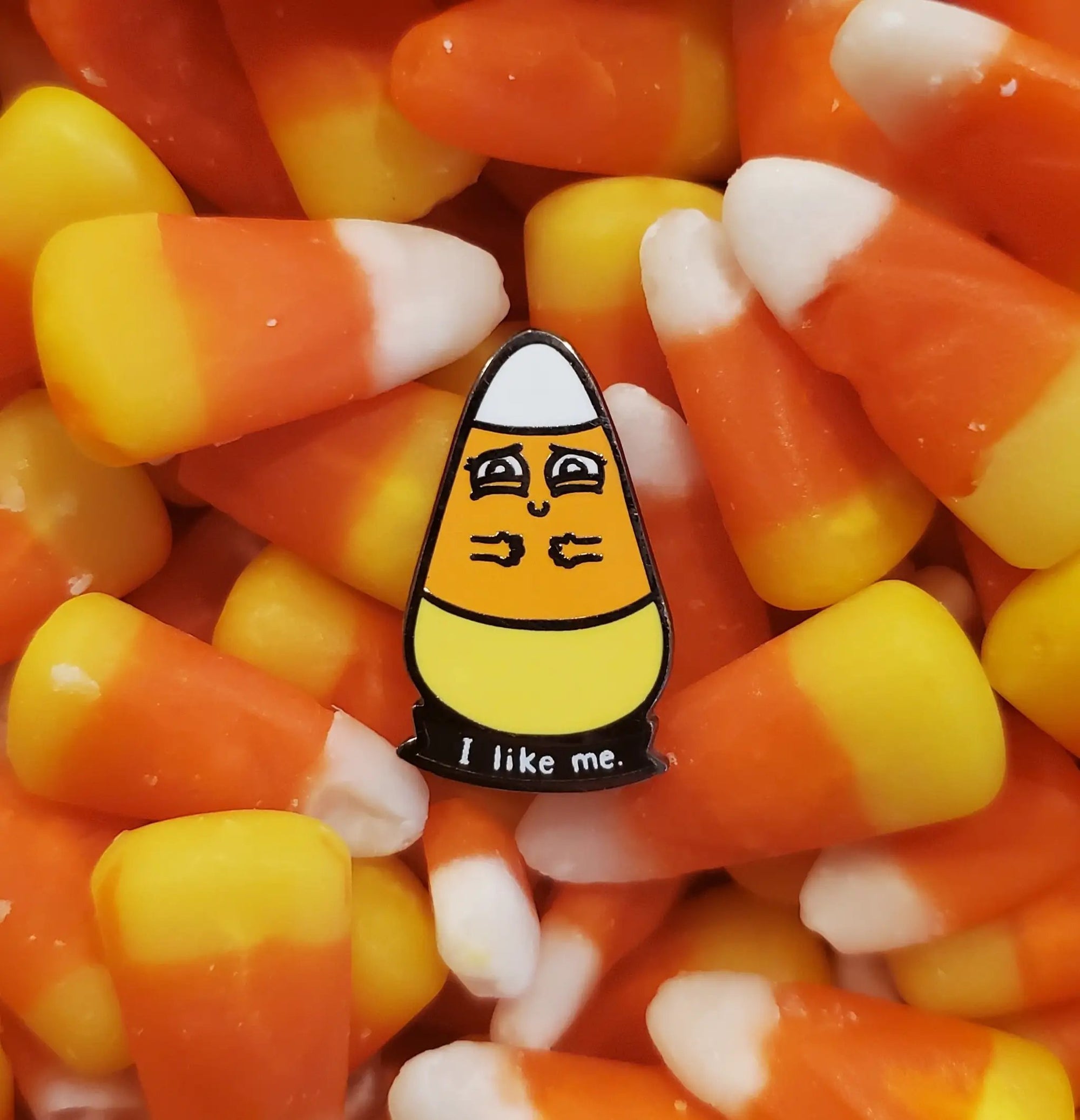 Colorful "I Like Me" candy pin by Kolorspun featuring bright, playful design on a metal lapel pin.