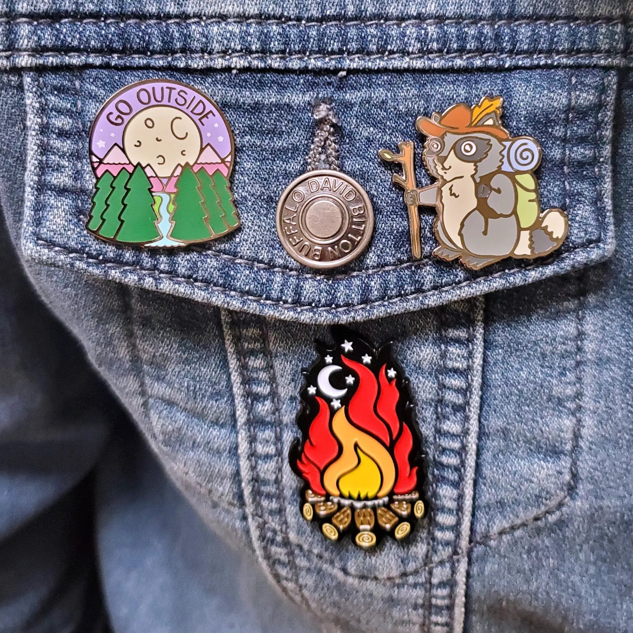 Kolorspun raccoon hiker pin featuring a detailed raccoon design, perfect for outdoor and nature-themed accessories.