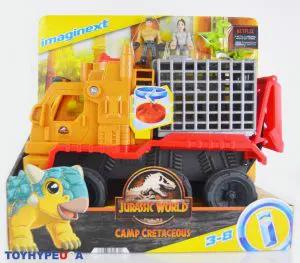 Jurassic World Camp Cretaceous Imaginext dinosaur hauler and Yaz action figure set featuring colorful toy vehicles and figures.