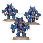 Space Marines Aggressor Squad miniatures from Warhammer 40K, detailed models with armor and weapons, ready for tabletop gaming.