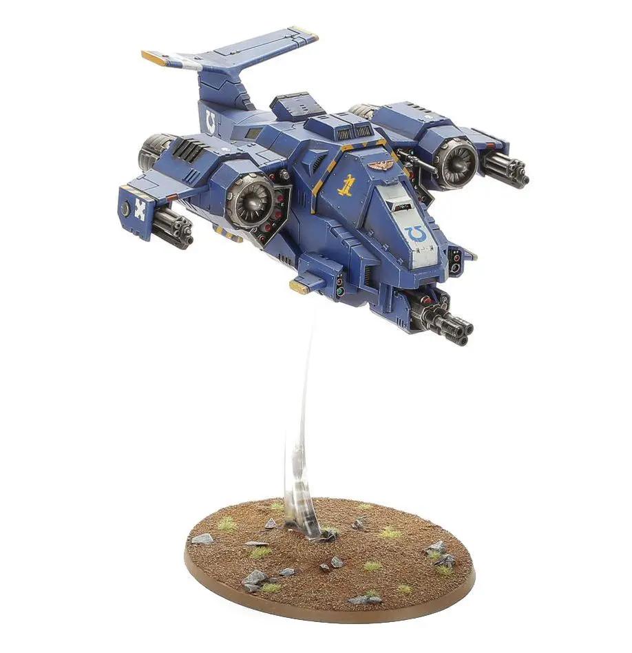 Space Marines Stormhawk Interceptor model from THE MIGHTY HOBBY SHOP, detailed miniature with blue and gray armor and wings.