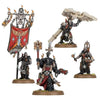 Chaplain Grimaldus with retinue, detailed miniature model from Warhammer 40k tabletop game, painted and posed for display.