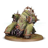 Death Guard Myphitic Blight-hauler miniature from Warhammer 40K, detailed green and metallic chaos vehicle with bio-organic armor.