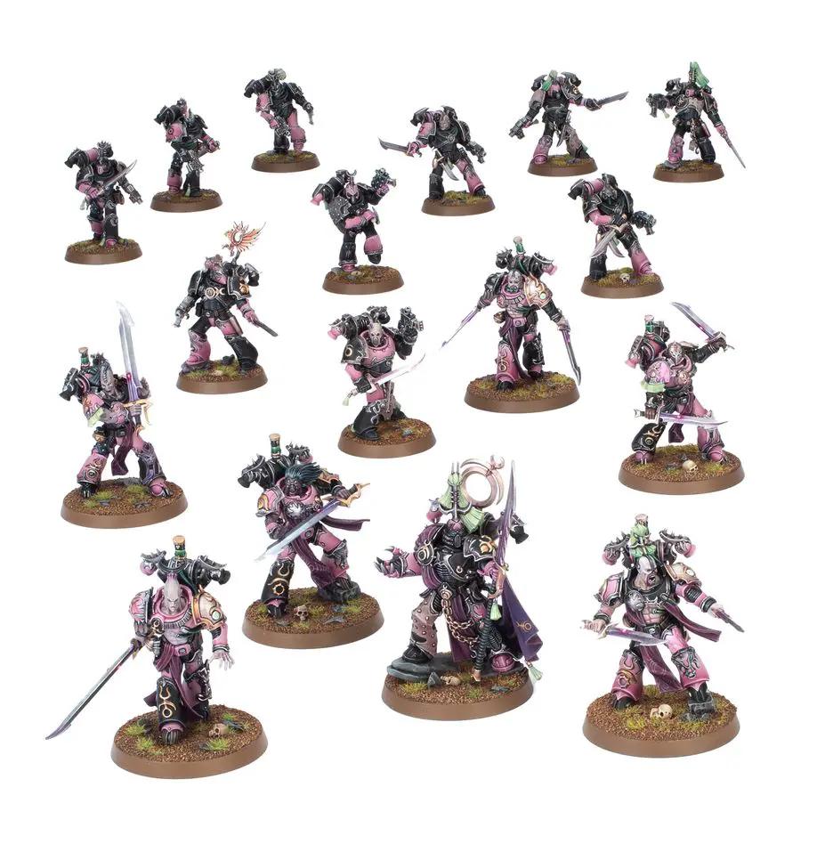 Miniature group of Emperor's Children Chaos Space Marines with detailed armor and weapons from Combat Patrol series.