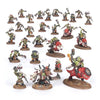 Orks from Warhammer 40,000 Combat Patrol set featuring detailed green-skinned Ork miniatures on a battlefield base.