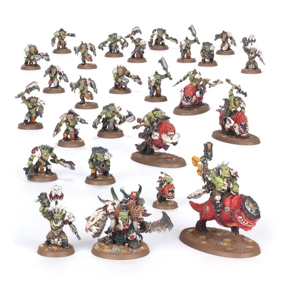Orks from Warhammer 40,000 Combat Patrol set featuring detailed green-skinned Ork miniatures on a battlefield base.