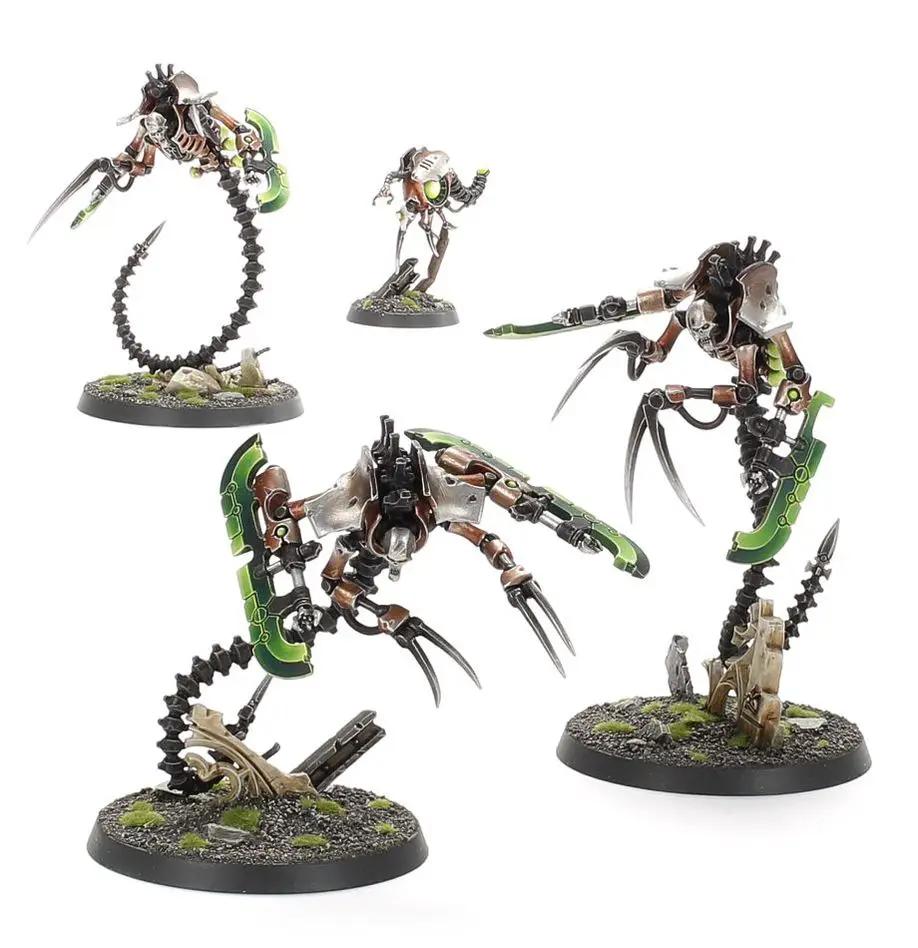 Necrons Ophydian Destroyers from Warhammer 40,000, detailed miniature models in green and metallic colors.