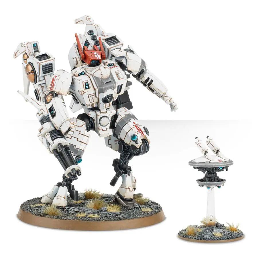 Warhammer 40,000 T'au Empire Commander miniature from The Mighty Hobby Shop, featuring detailed armor and weaponry.