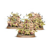 Group of Nurgling miniatures from Warhammer Age of Sigmar, featuring small, green, tentacled creatures with grotesque expressions.
