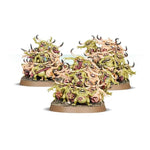 Group of Nurgling miniatures from Warhammer Age of Sigmar, featuring small, green, tentacled creatures with grotesque expressions.