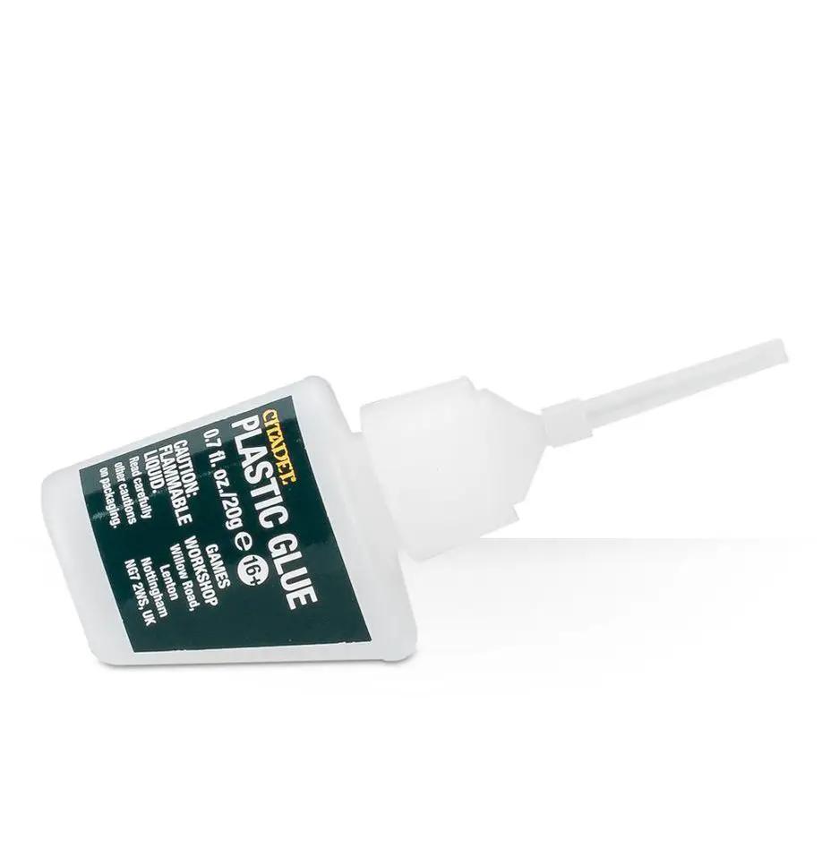 Plastic glue for Warhammer models from THE MIGHTY HOBBY SHOP, shown in a clear bottle with a white cap for assembling miniatures.