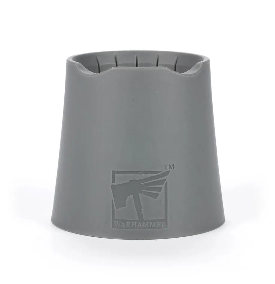 Warhammer water pot from THE MIGHTY HOBBY SHOP, featuring a compact, gray plastic container used for miniature painting and gaming.