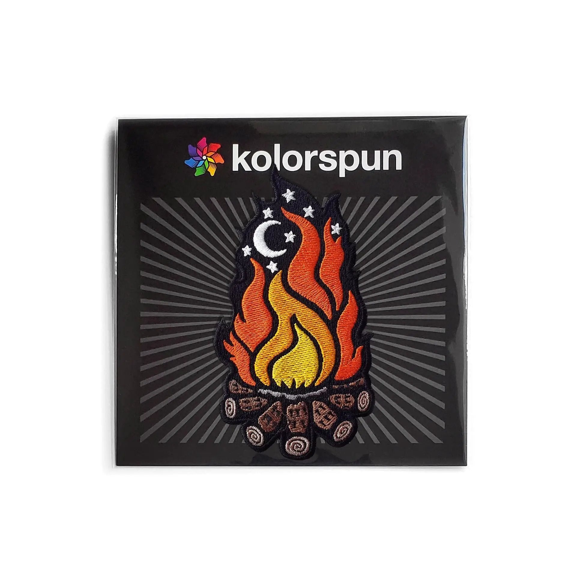 Kolorspun campfire patch attached to a backing card, featuring a colorful campfire design on a square patch.