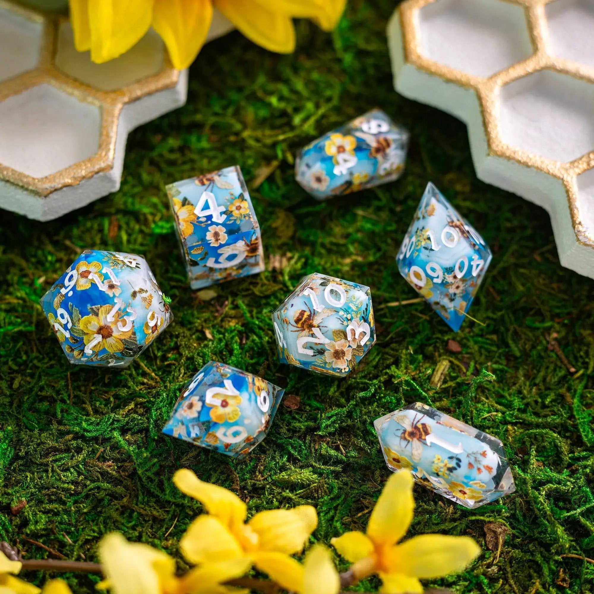 Handmade resin DND dice set featuring bees and flowers design by Runic Dice, with intricate bee and floral patterns in vibrant colors.
