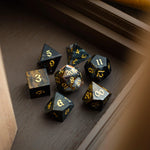 Black gemstone eagle eye hand-carved DND dice set by Runic Dice, featuring detailed, polished gemstone polyhedral dice for tabletop gaming.