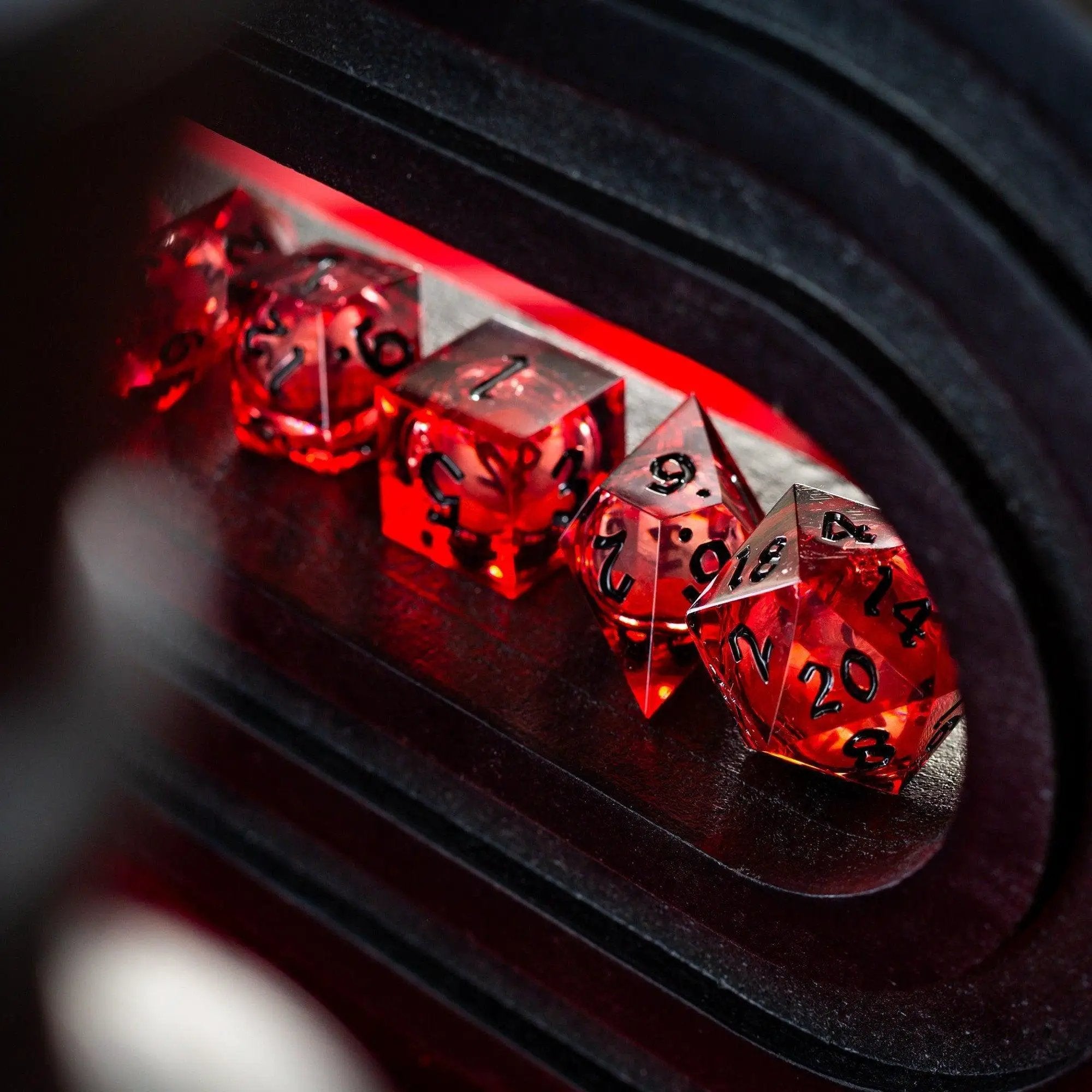 Blood red glitter liquid core handmade resin DND dice set by Runic Dice, featuring vibrant red and sparkling glitter details.