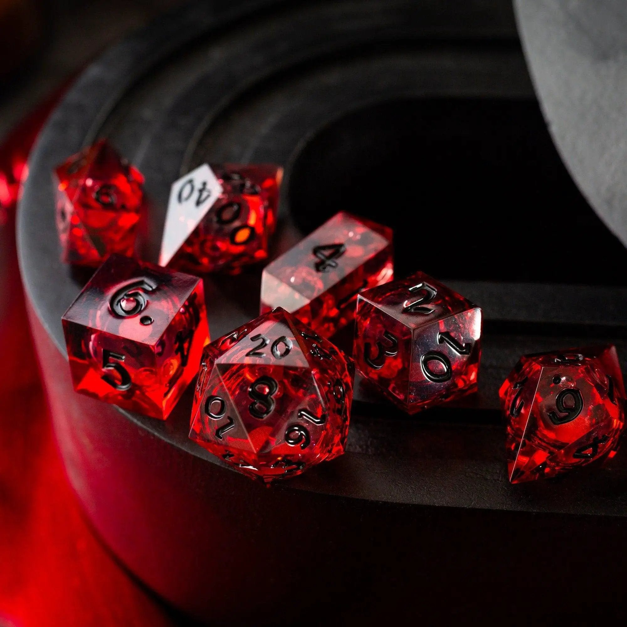 Blood-red glitter liquid core handmade resin D&D dice set by Runic Dice, featuring vibrant red and sparkling glitter details.
