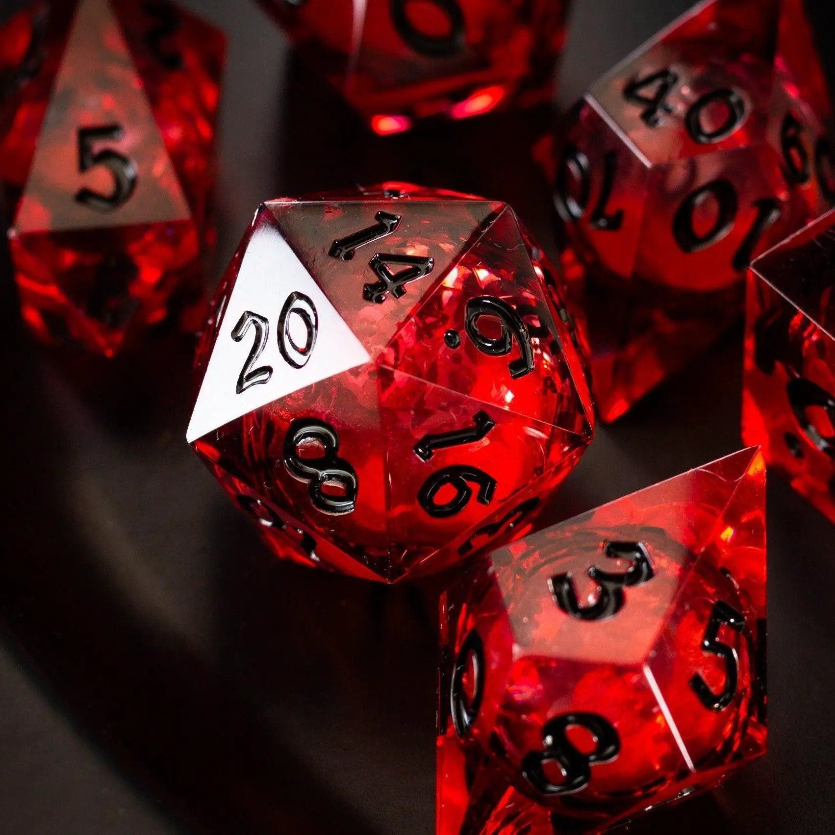 Blood red glitter liquid core handmade resin DND dice set by Runic Dice, featuring vibrant red with shimmering glitter.
