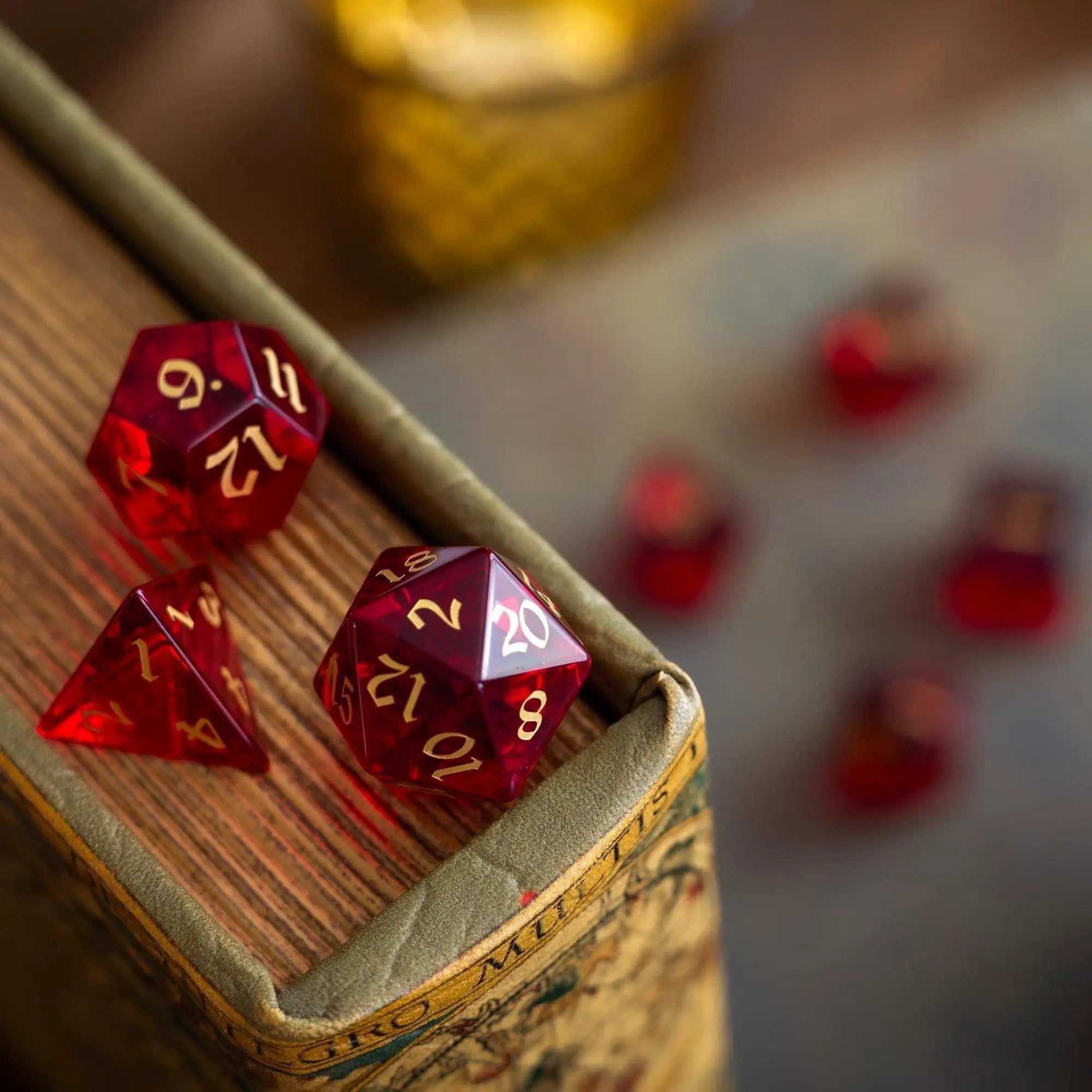Blood red hand-carved zircon glass DND dice set by Runic Dice, featuring gemstone design and intricate craftsmanship.