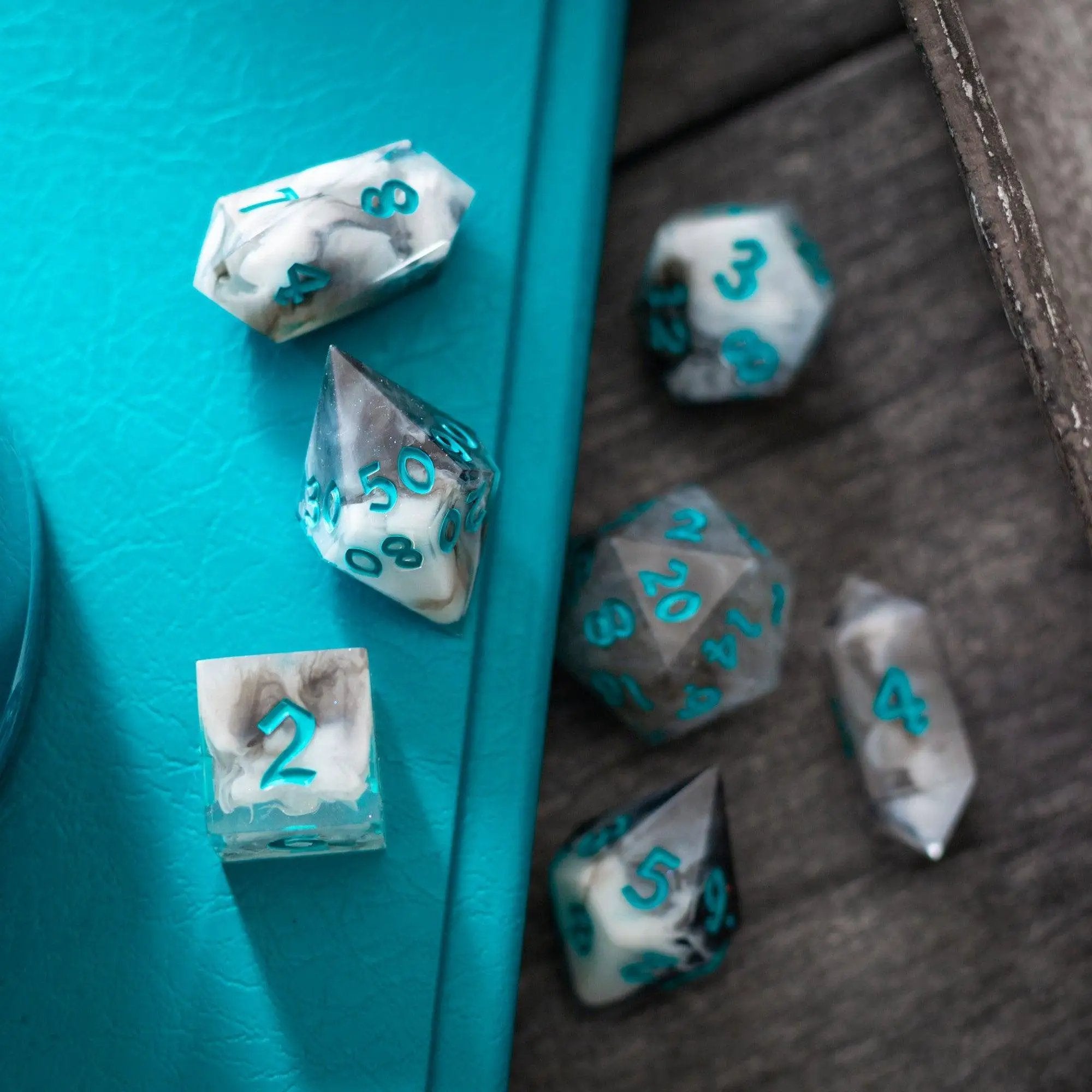Blue cloud handmade resin DND dice set by Runic Dice, featuring six colorful, swirling resin dice for tabletop gaming.