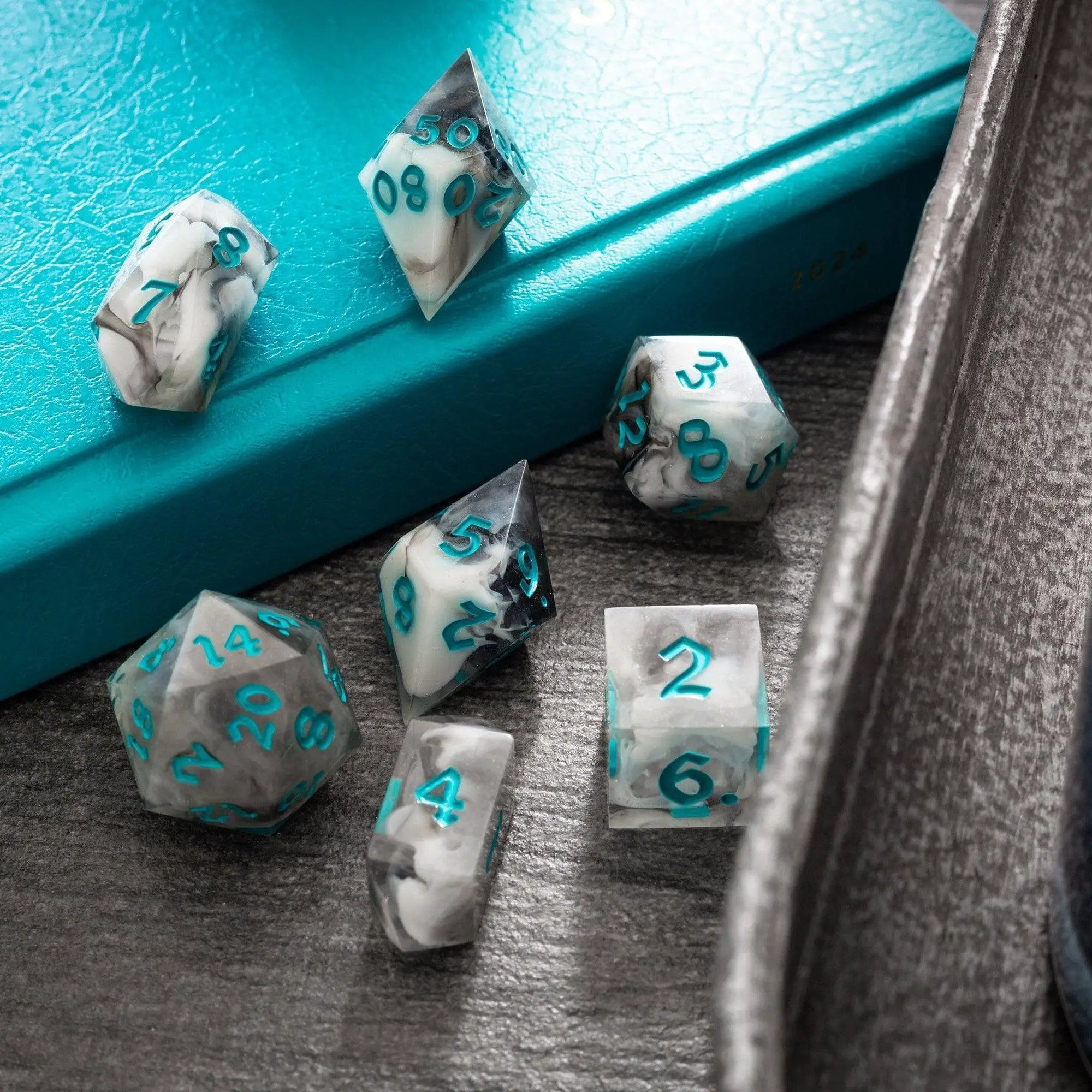 Blue cloud-themed handmade resin DND dice set by Runic Dice, featuring a mix of blue and white cloud pattern in a complete set.
