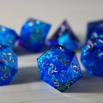 Blue handmade resin DND dice set with sharp edges, featuring white numbering, by Runic Dice.