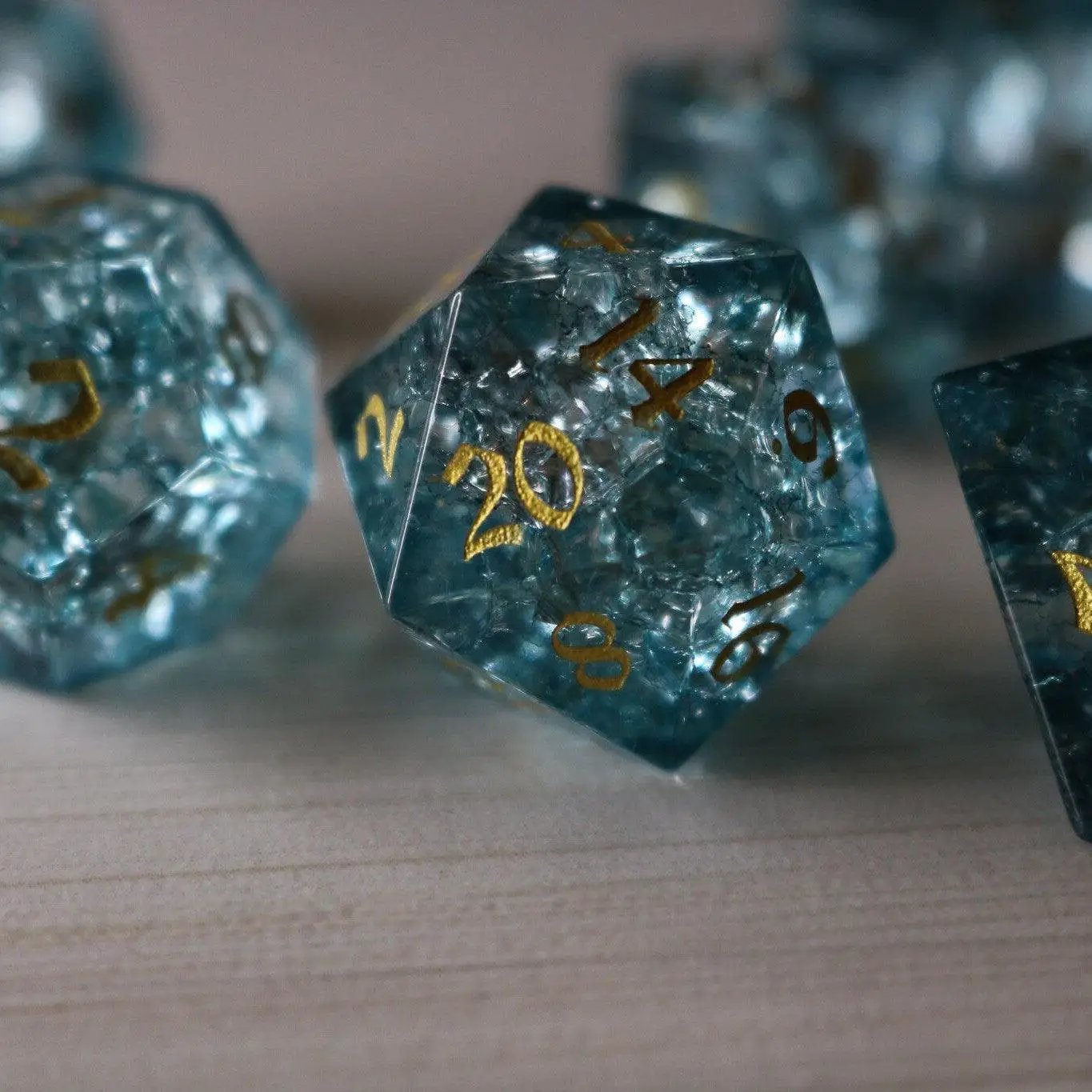 Blue Ocean Forge Fire Glass DND gemstone dice set by Runic Dice featuring vibrant blue and fiery orange dice for tabletop gaming.