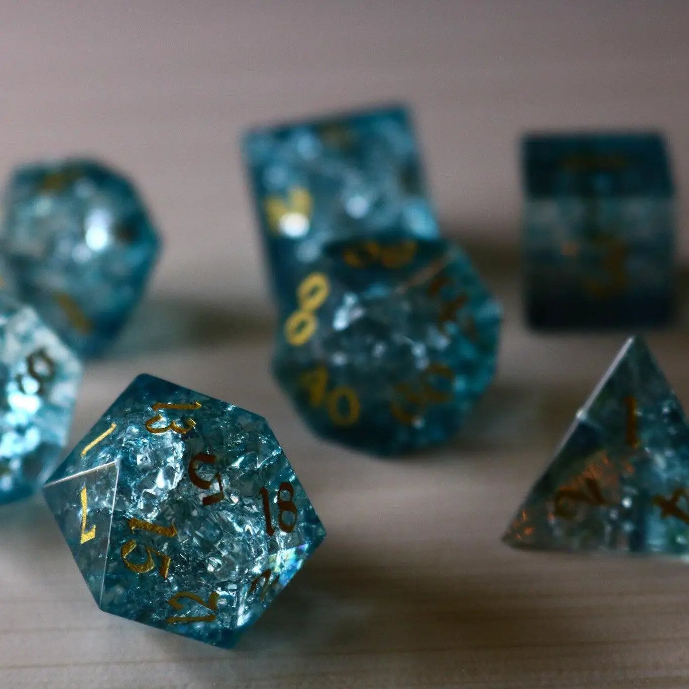 Blue Ocean Forge Fire Glass DND gemstone dice set by Runic Dice, featuring vibrant blue and fiery orange colors.