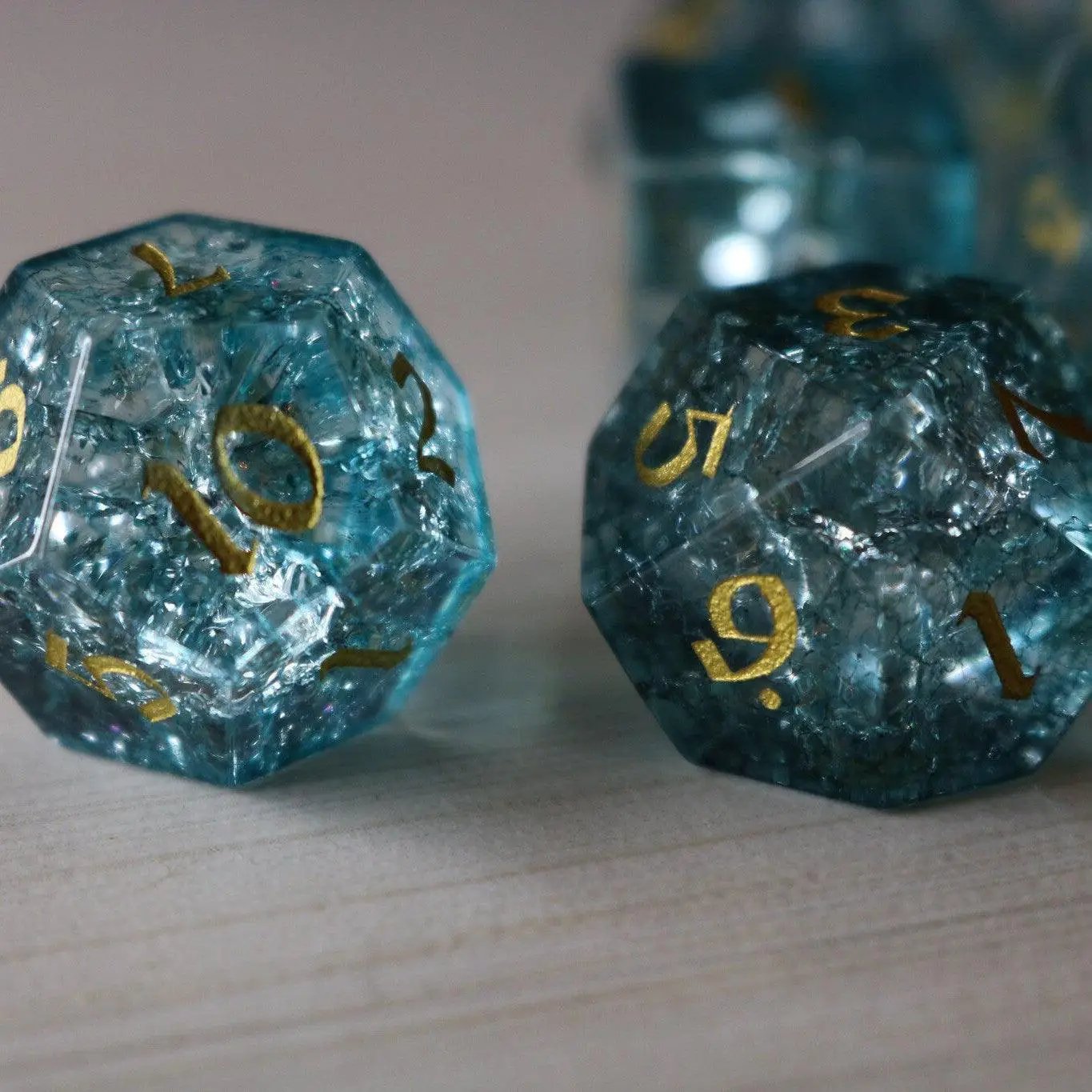 Blue Ocean Forge fire glass gemstone DND dice set by Runic Dice, featuring vibrant blue and fiery glass design for tabletop gaming.