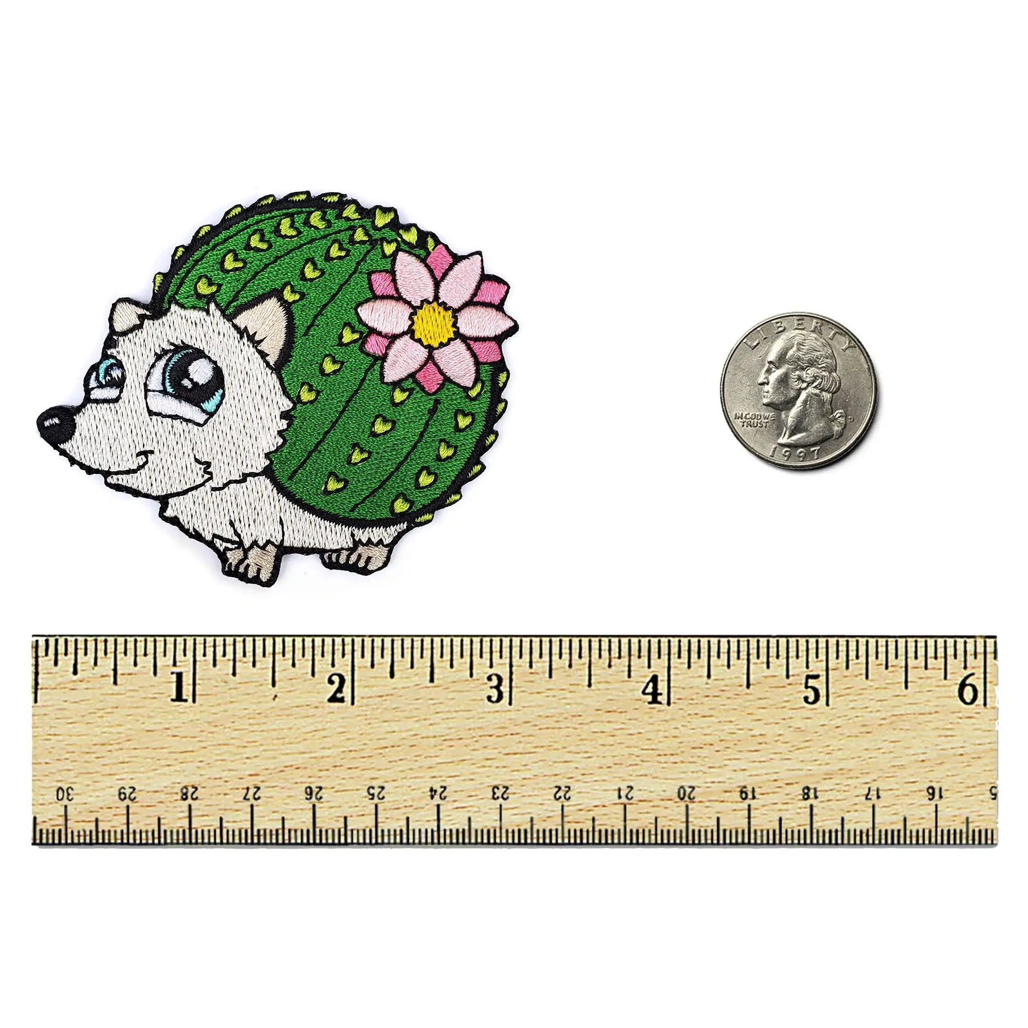 Kolorspun cactus hedgehog patch featuring a green cactus design, suitable for clothing or accessories, on a ruler background.