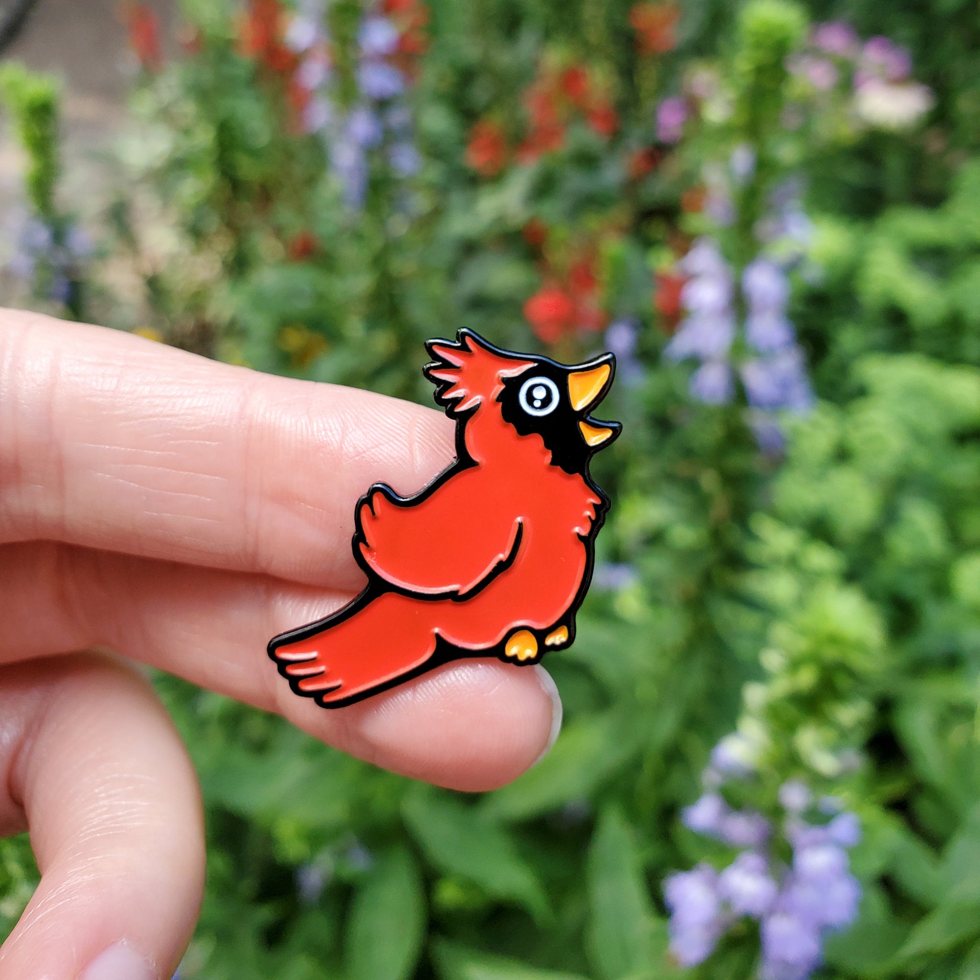 Kolorspun Cardinal pin with a red cardinal bird design, crafted as a small decorative lapel pin on a white background.