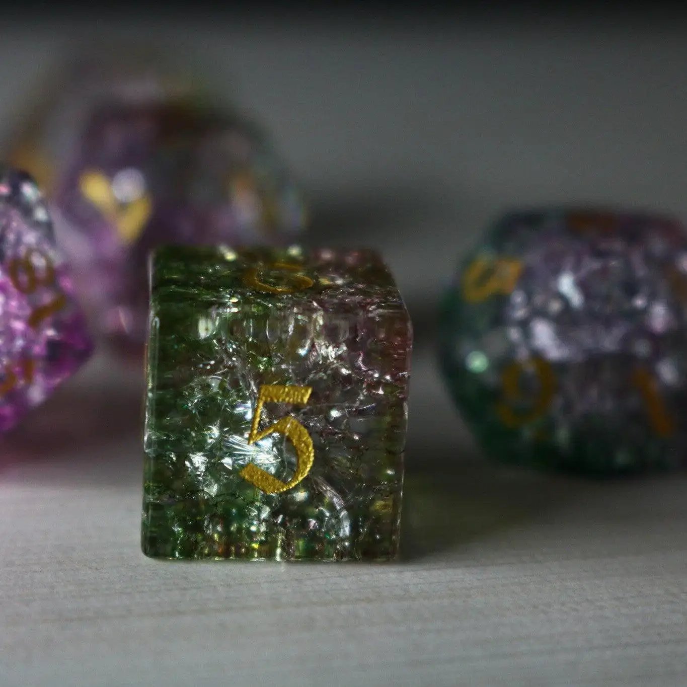 Dark Nox Forge Fire Glass DND gemstone dice set by Runic Dice, featuring fiery-colored polyhedral dice for tabletop gaming.