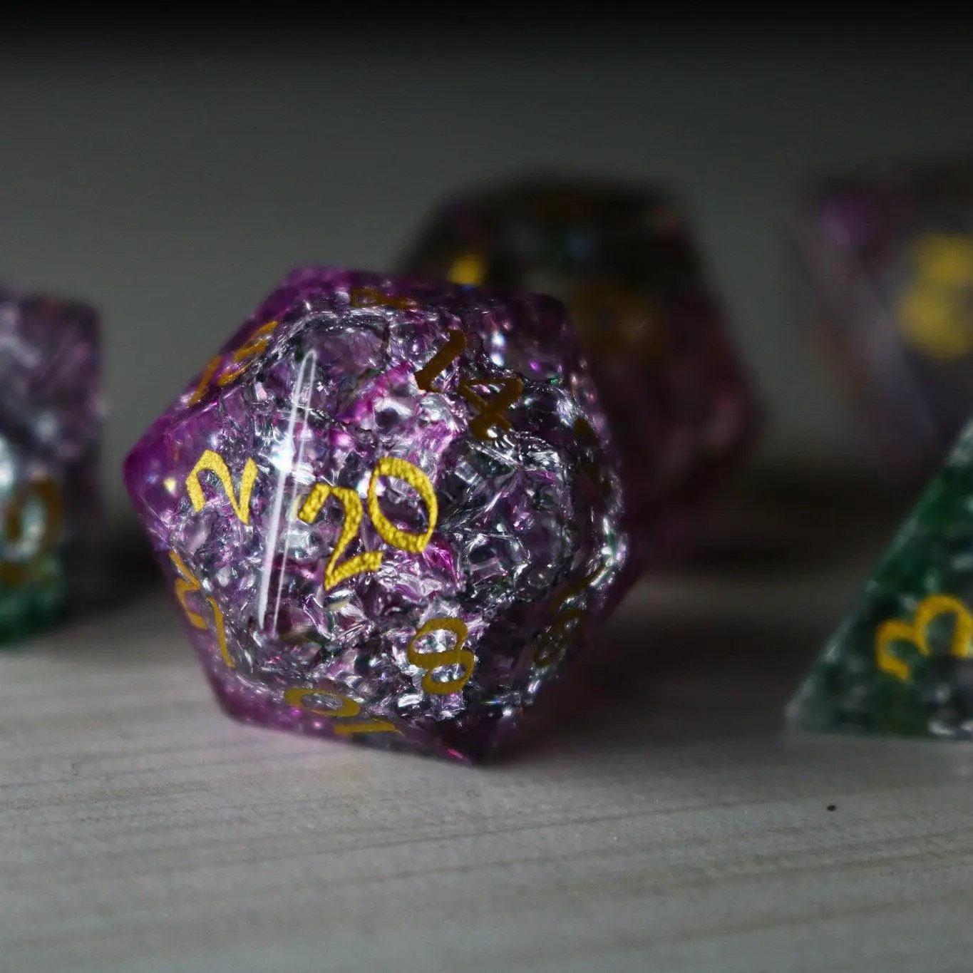 Dark Nox Forge Fire Glass DND gemstone dice set by Runic Dice, featuring fiery orange and black swirling patterns on each die.