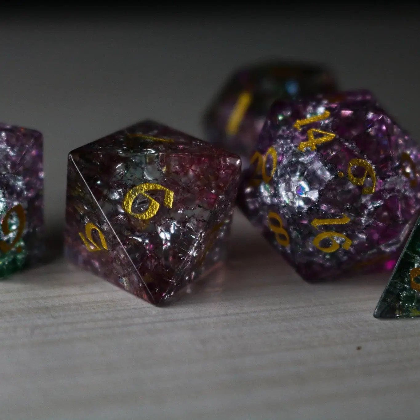 Set of Dark Nox Forge Fire Glass gemstone D&D dice by Runic Dice, featuring fiery red and black colors with a polished finish.