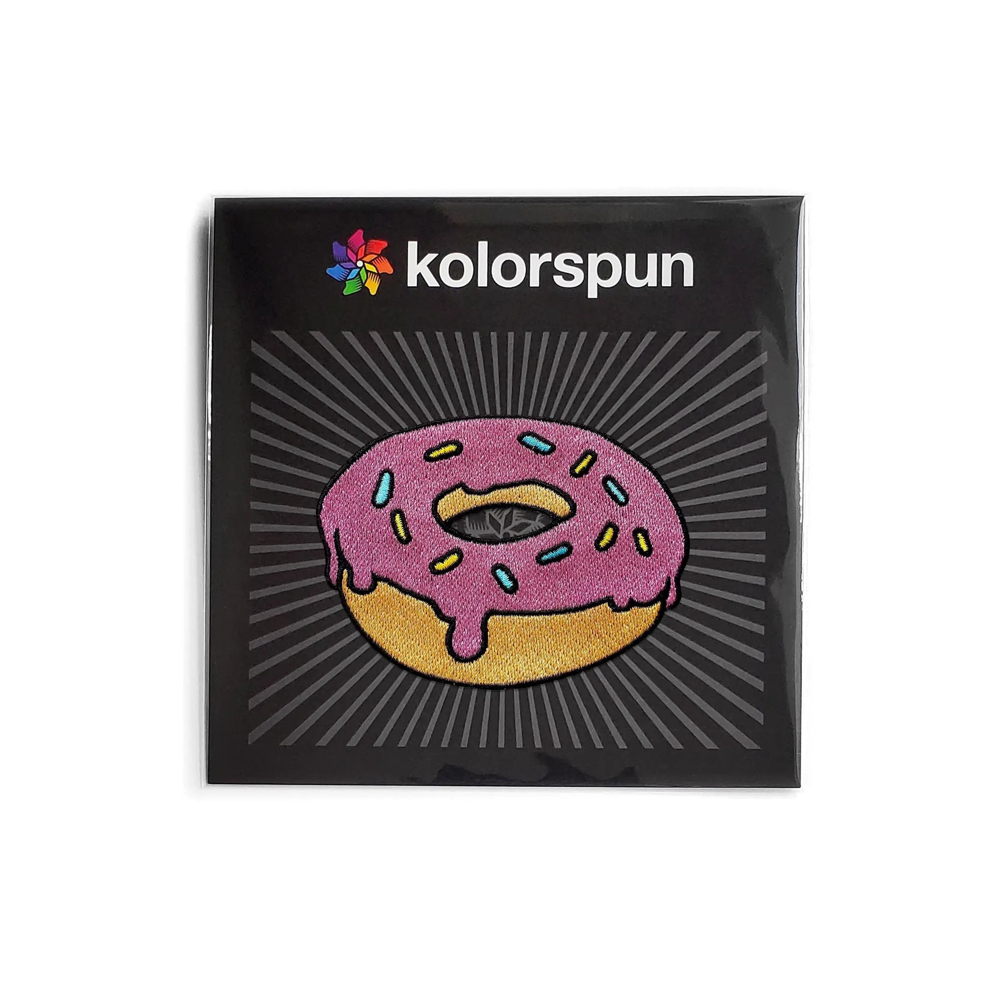 Colorful donut patch by Kolorspun featuring a realistic donut design with sprinkles, perfect for decorating clothing or accessories.