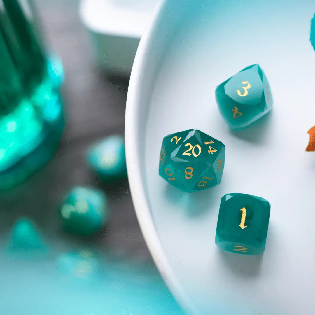 Runic Dice dwarf-cut aquamarine cat's eye gemstone DND dice set with polished, vibrant blue dice for tabletop gaming.