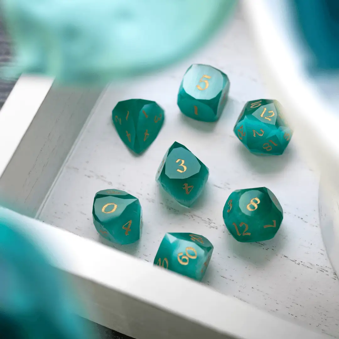 Dwarf cut aquamarine cat’s eye gemstone DND dice set by Runic Dice, featuring polished, translucent gemstone dice for tabletop gaming.
