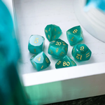 Runic Dice dwarf-cut aquamarine cat’s eye gemstone DND dice set, featuring polished, vibrant gemstone dice for tabletop gaming.