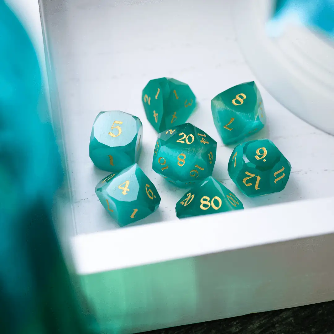 Runic Dice dwarf-cut aquamarine cat’s eye gemstone DND dice set, featuring polished, vibrant gemstone dice for tabletop gaming.