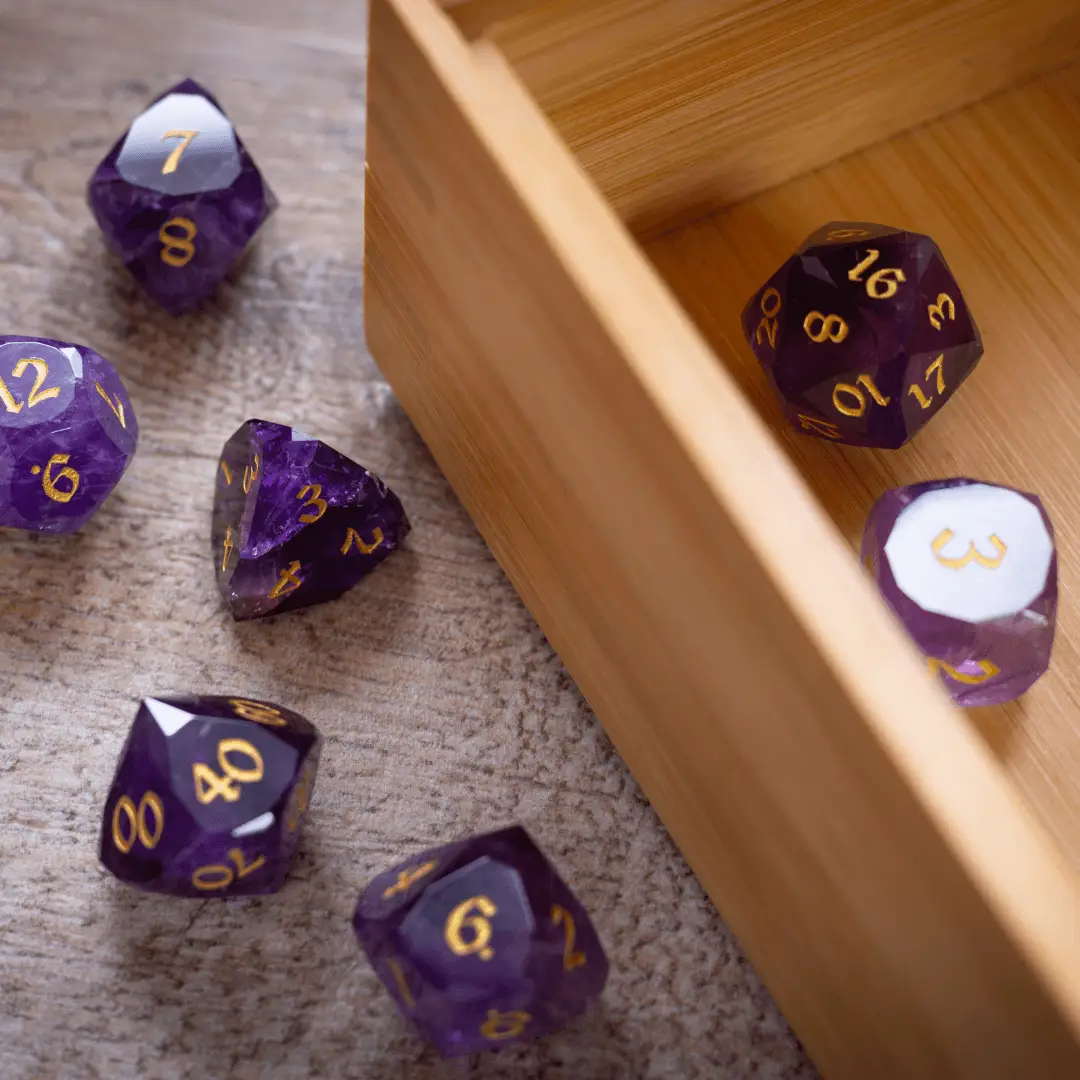 Dwarf cut purple amethyst gemstone dice set by Runic Dice, premium D&D gemstone dice with intricate dwarf cut design.