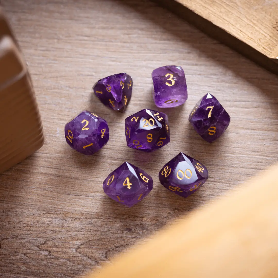 Dwarf cut purple amethyst gemstone dice set by Runic Dice, featuring premium DND gemstone dice with intricate purple crystal facets.