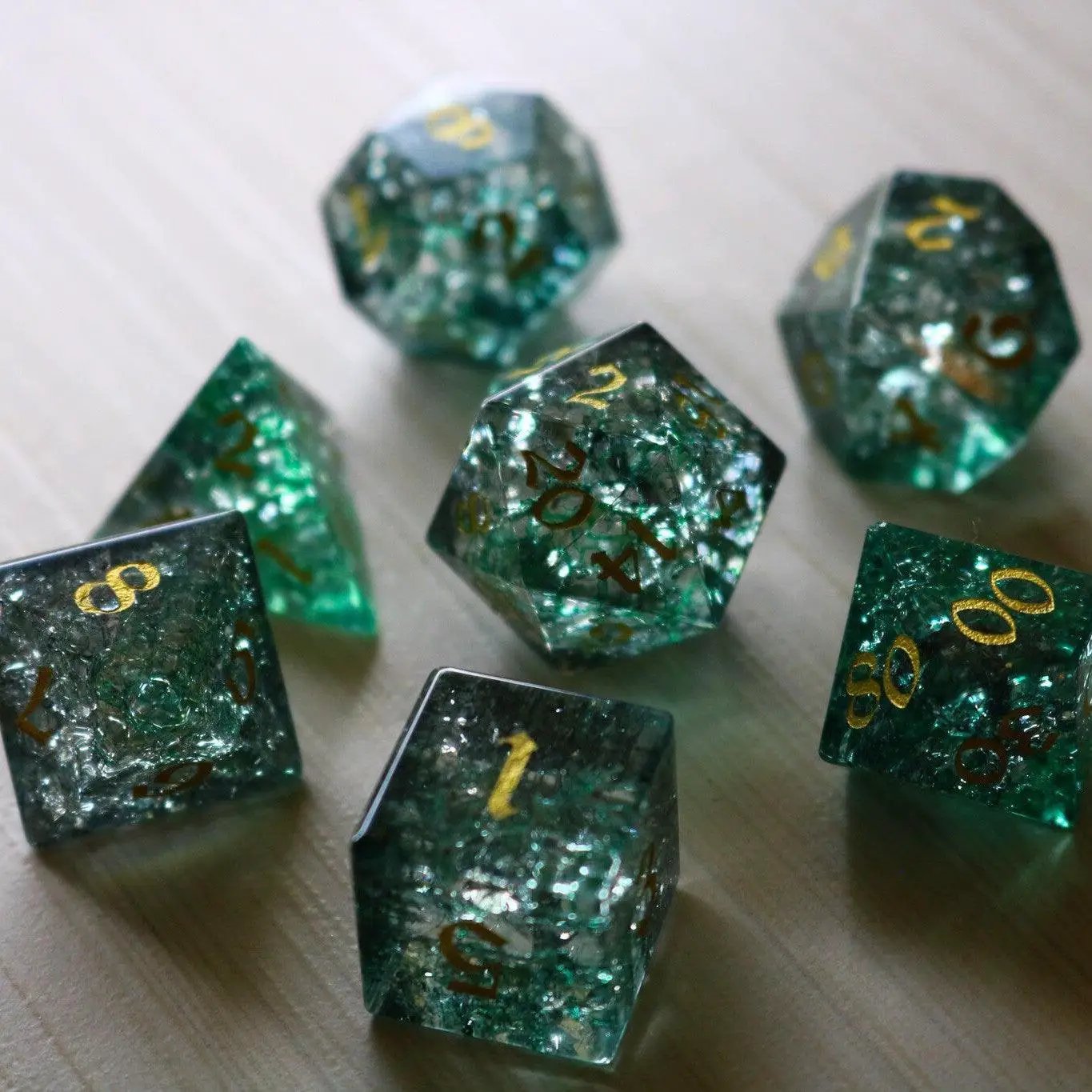 Set of gemstone DND dice, Elven Wood Green Forge Fire Glass, by Runic Dice, featuring a vibrant green and fiery design.