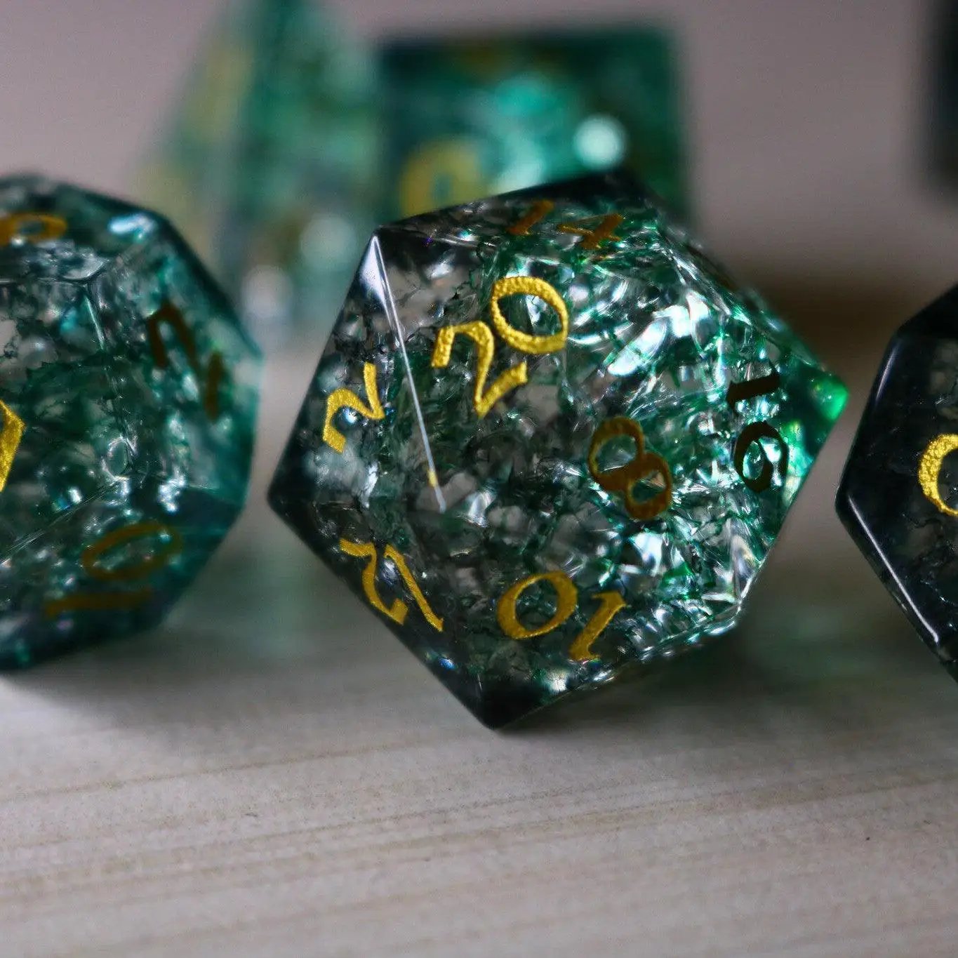Elven Wood Green Forge Fire Glass DND gemstone dice set by Runic Dice, featuring vibrant green and fiery orange accents.