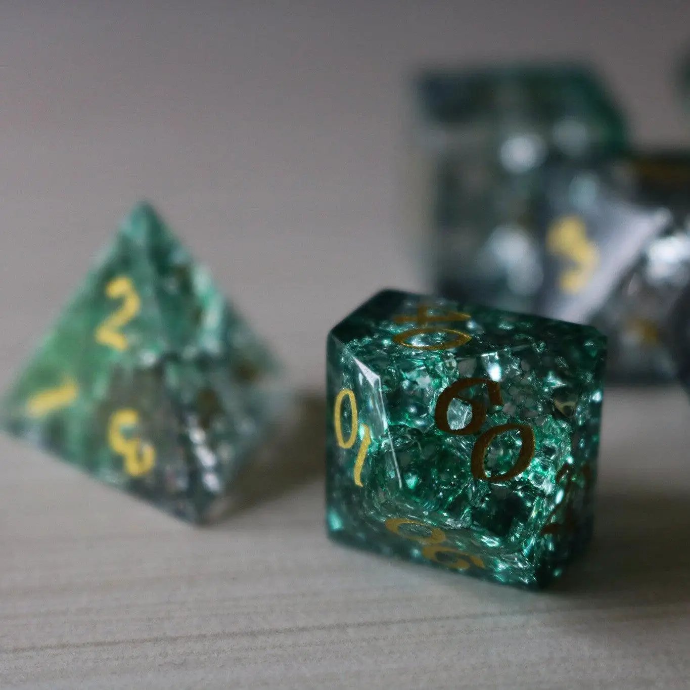 Elven Wood Green Forge Fire Glass DND gemstone dice set by Runic Dice, featuring vibrant green and fiery design elements.